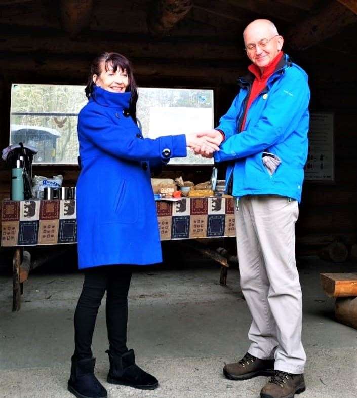 Dunnet Forestry Trust director, Stephen Frame, receiving the Volunteer Friendly Award from Catherine Patterson, volunteer development officer at Caithness Voluntary Group.