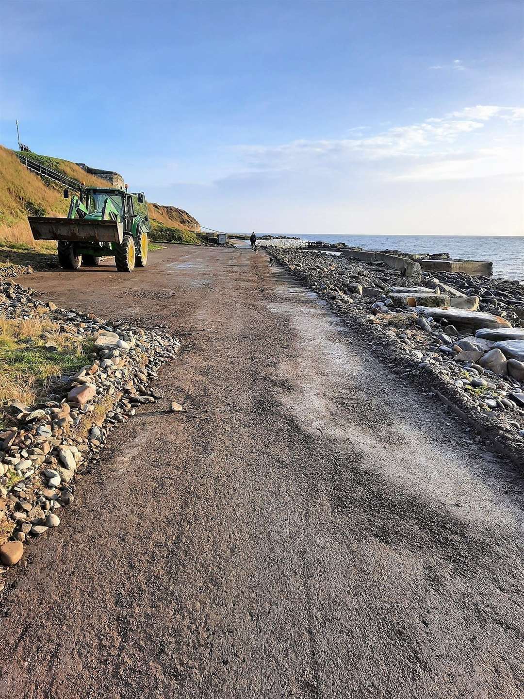 Wick Paths Group chair Willie Watt had the use of a specialist vehicle to remove the stones on the road.
