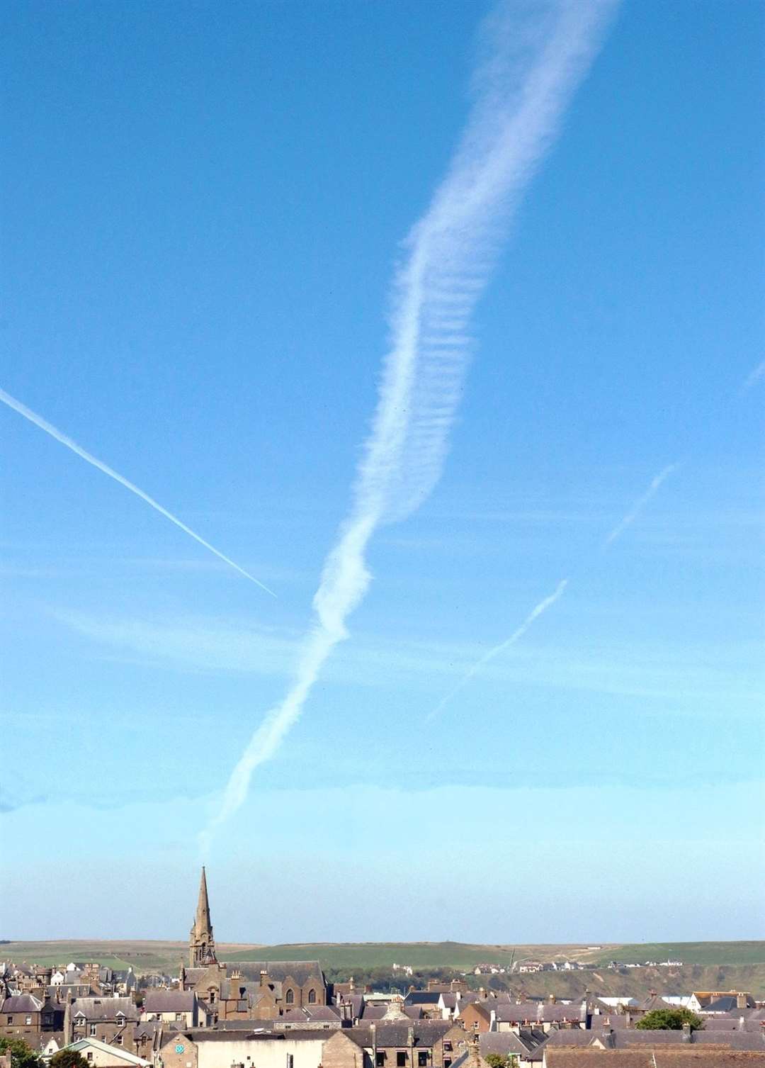 The shot Alan McIvor took from his window seems to show a jet trail or cloud formation emanating from the spire of the church in Olrig Street.