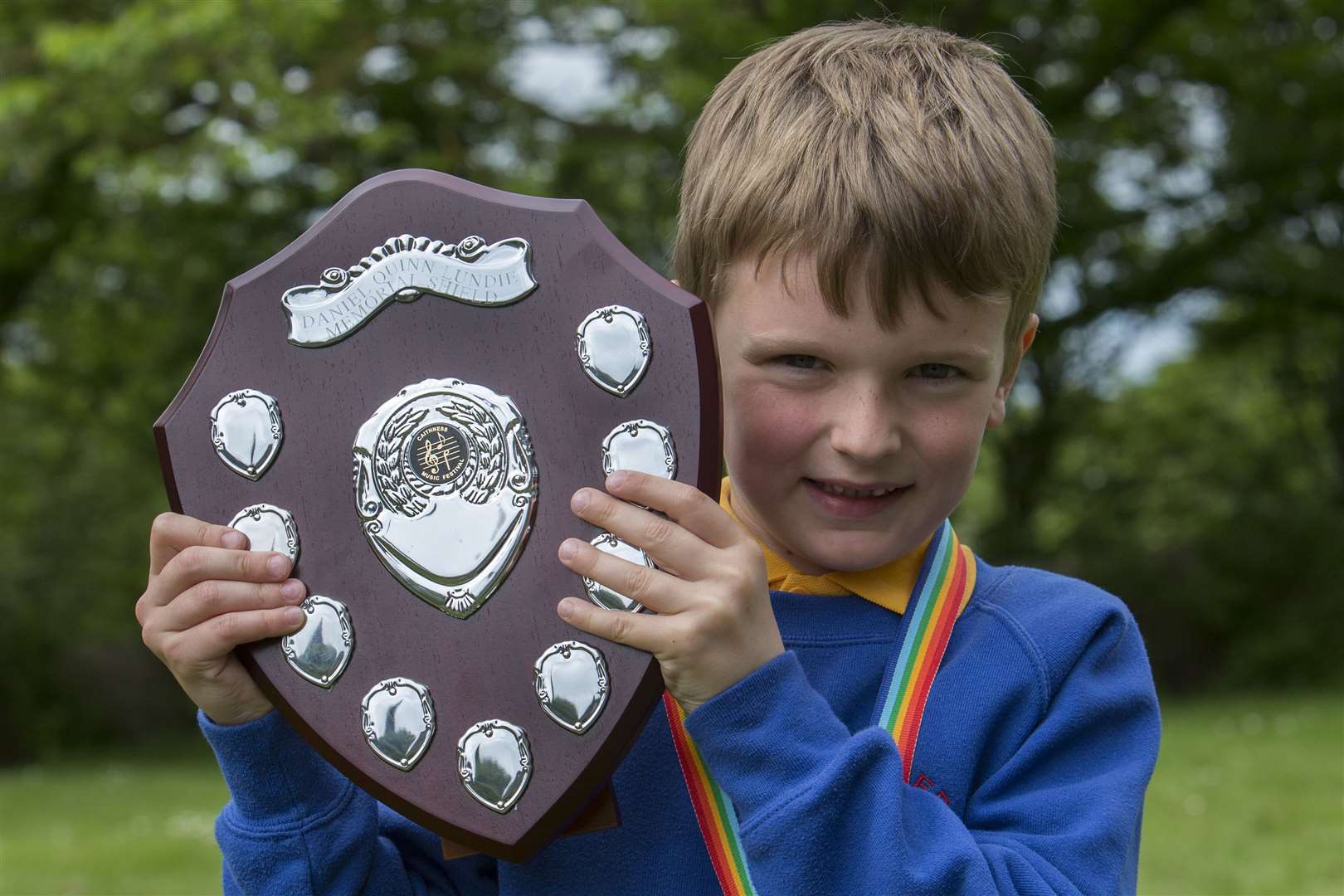 This year's music festival has two new trophies donated by Dennis Lundie, retired head teacher at Wick North Primary School. The first to be competed for was the Daniel Quinn Lundie Shield, in memory of Mr Lundie's late father. It was awarded to Matthew MacDonald for verse speaking, boys P2. Picture: Robert MacDonald / Northern Studios
