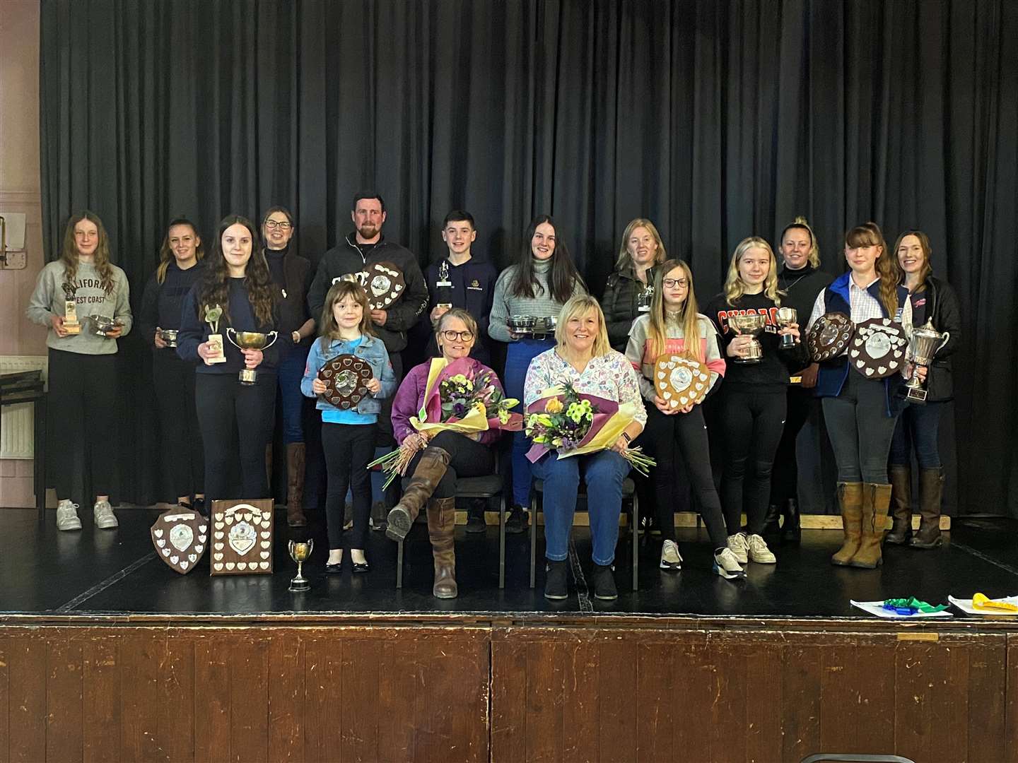 Prize winners at Caithness Riding Club along with retiring club secretary Jacky MacMillan (seated, centre right) and retiring minute secretary Donna Mather.