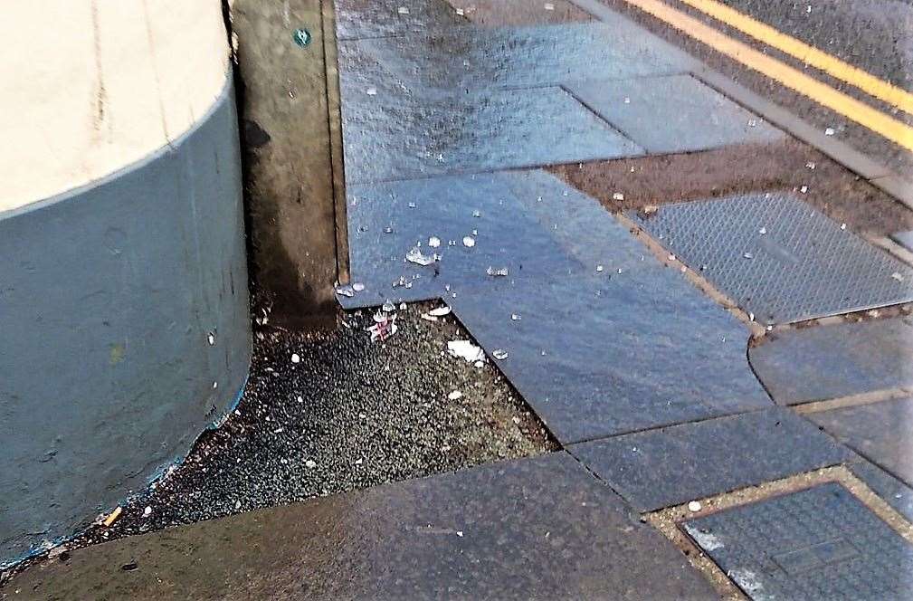 Broken glass lies on the ground and poses a danger to dogs. Picture: Derek Bremner