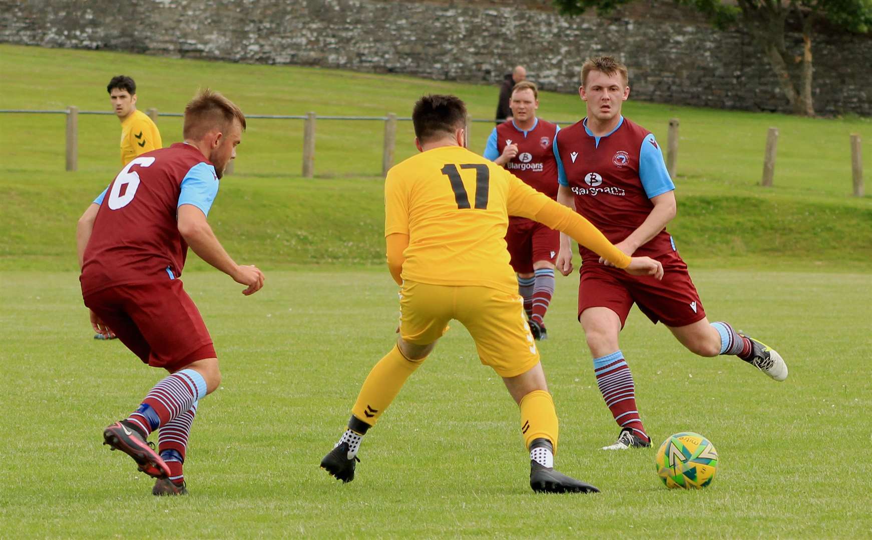 Staxigoe United's Ross Davidson is closed down by Pentland United pair Luke Manson (left) and Andy Mackay.