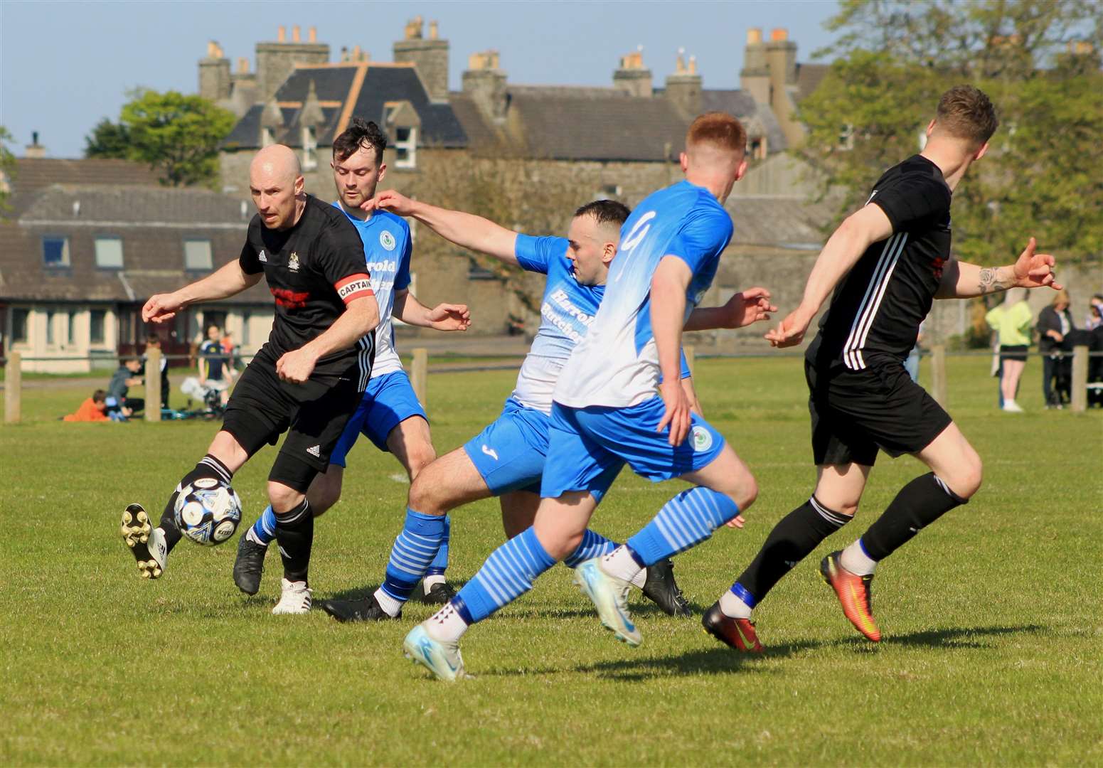 Lybster's Gary Weir tries to find a way through against Wick Thistle at the Upper Bignold. Picture: Alan Hendry