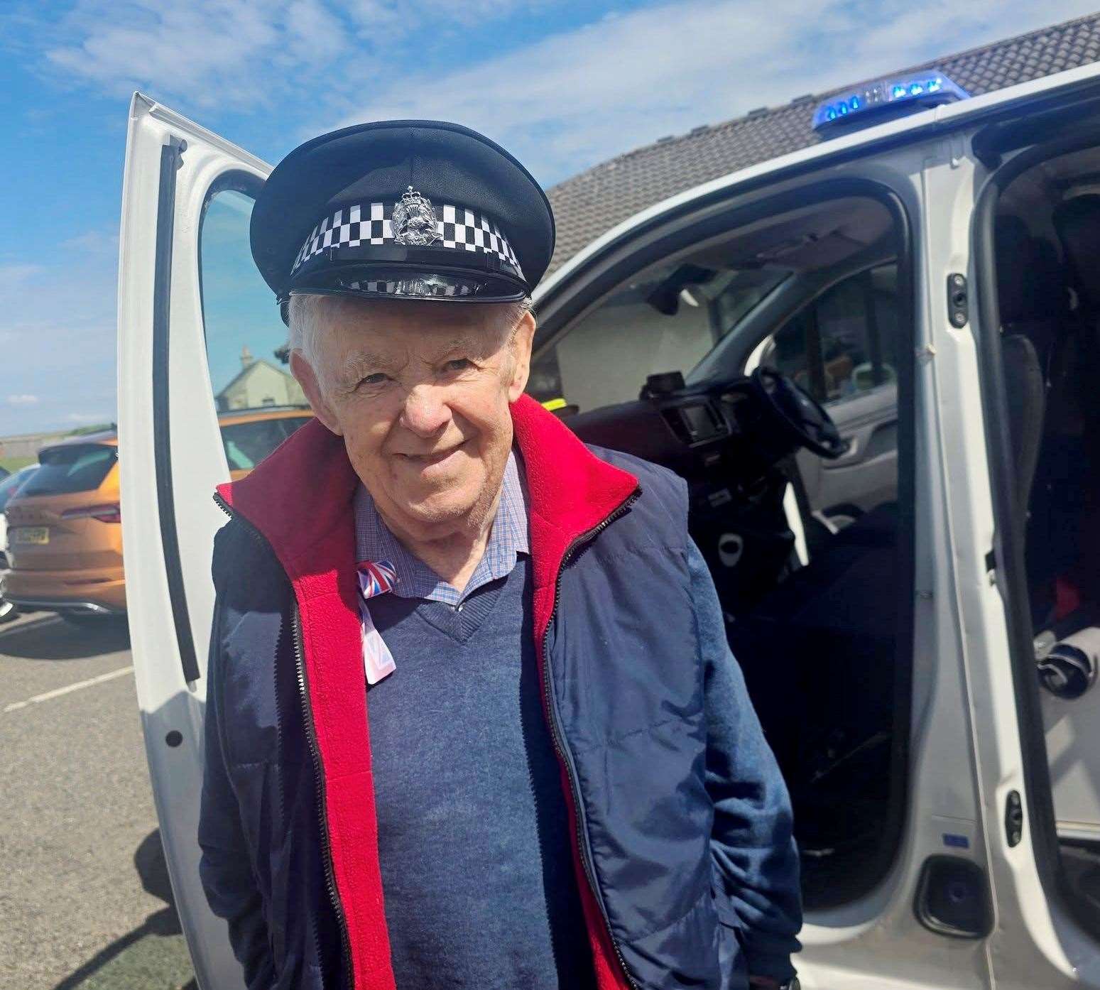 Willie Bain enjoyed seeing visiting police van, even trying on a police hat.