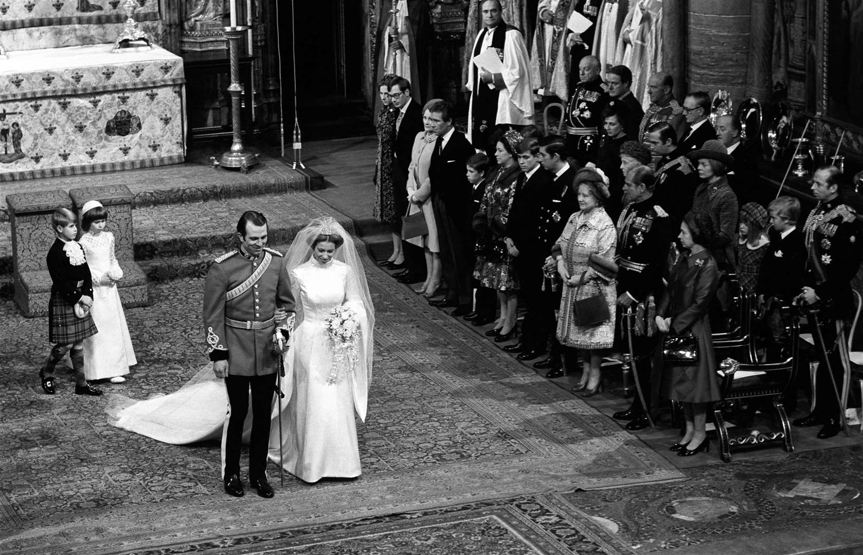 A curtsey for her mother, the Queen, from Princess Anne, after she had married Captain Mark Phillips at Westminster Abbey in 1973 (Archive/PA)