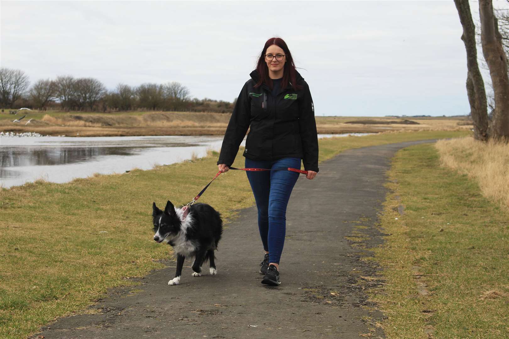 Jodie Wilson, Highland Council's assistant community works officer, taking her collie Gypsy for a walk on the Wick riverside footpath. Picture: Alan Hendry