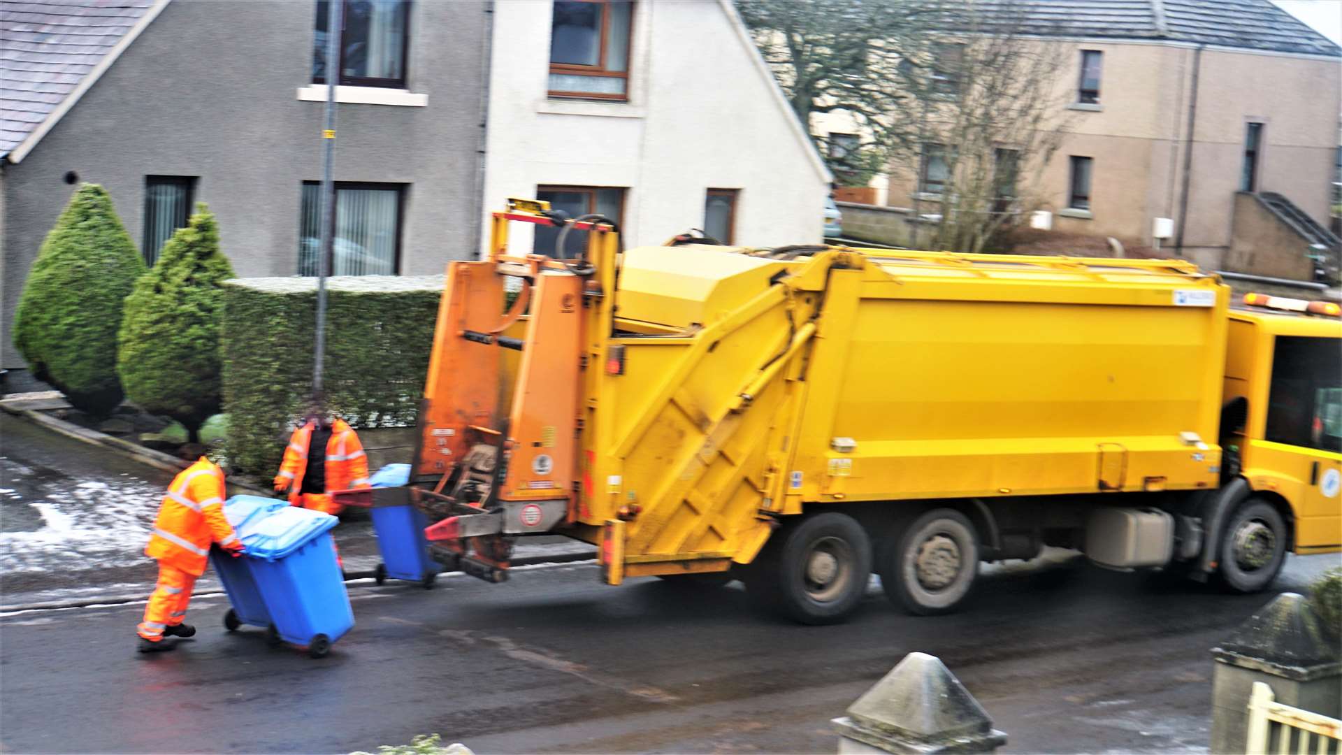 Recycling bins being picked up in Wick by council workers. The blue bins will be converted to collect paper and card. Picture: DGS