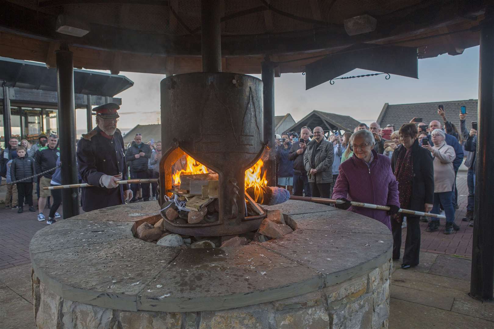 Lord Thurso and Nellie Manson lighting the John O'Groats jubilee beacon. Picture: Robert MacDonald / Northern Studios