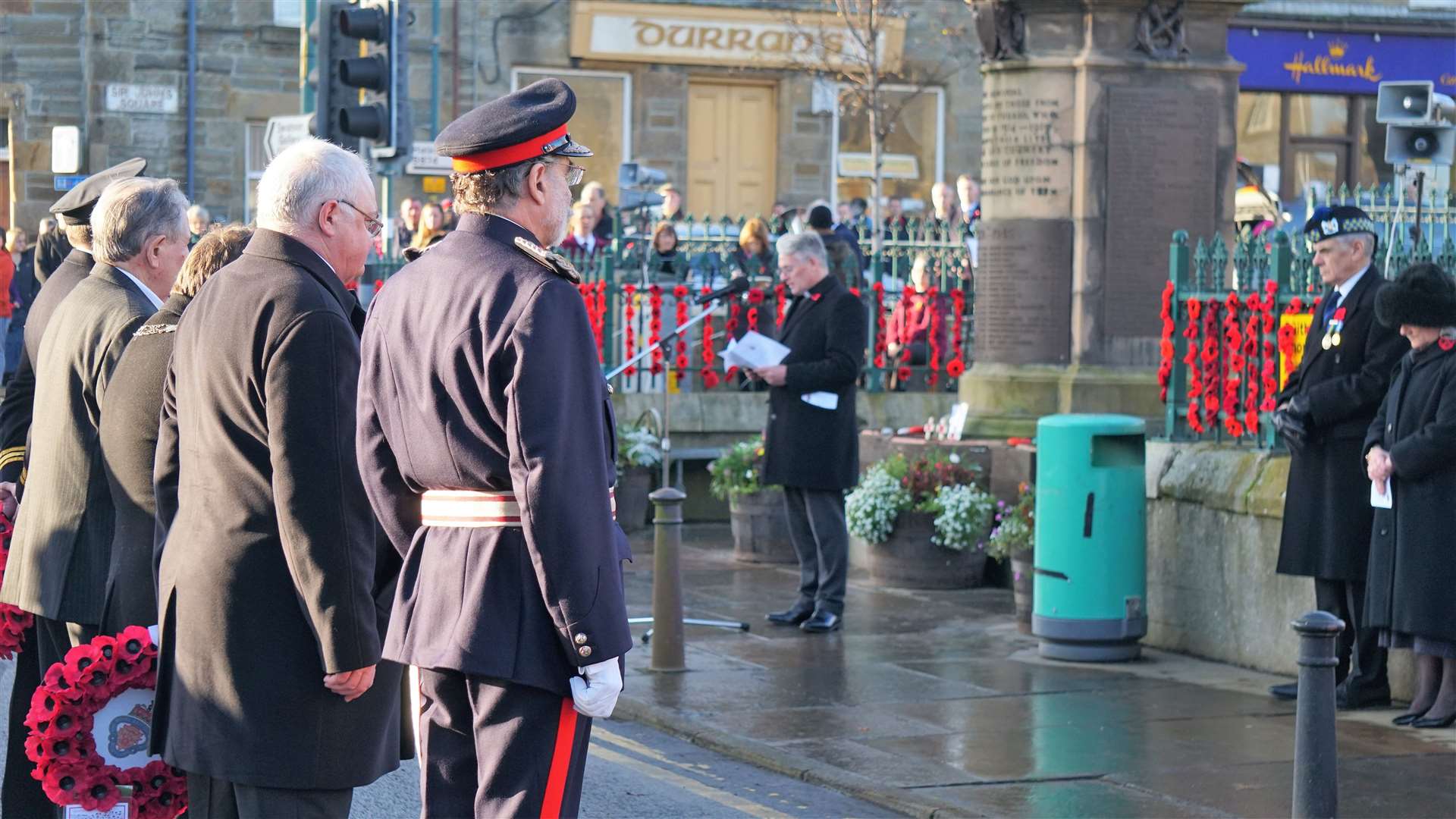 Lord Thurso and others await to lay their wreaths. Picture: DGS