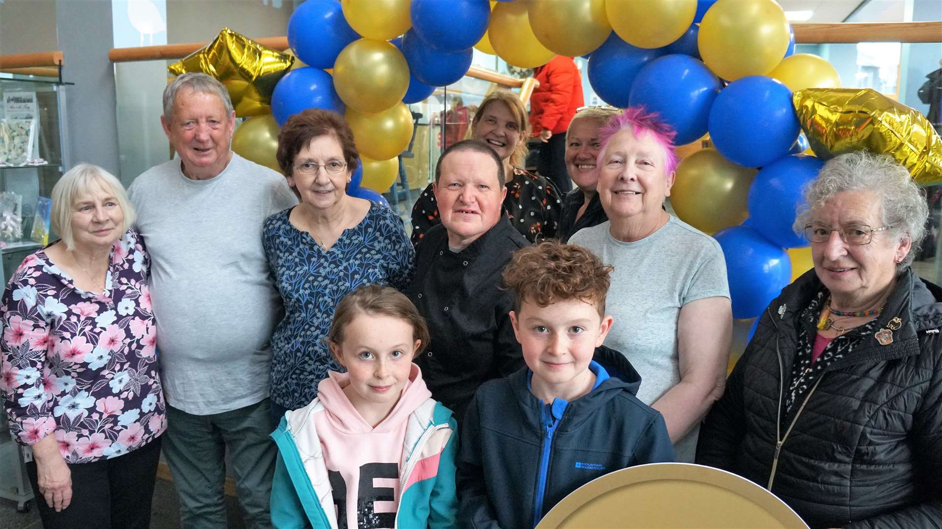 PPP lunch club volunteers along with Jane McCarthy at right and her grandchildren Carey and Alex. Jane picked the lunch club to be the beneficiary of the £10K. Picture: DGS
