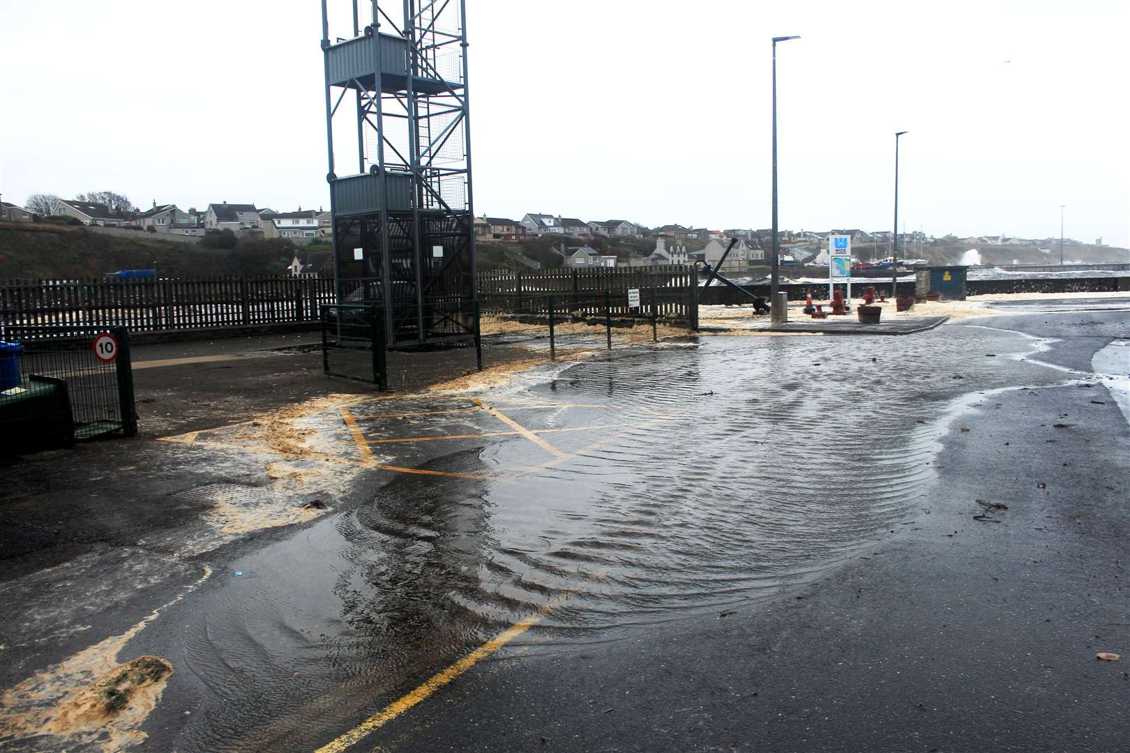 Water encroaching onto Martha Terrace beside the fire station. Picture: Alan Hendry