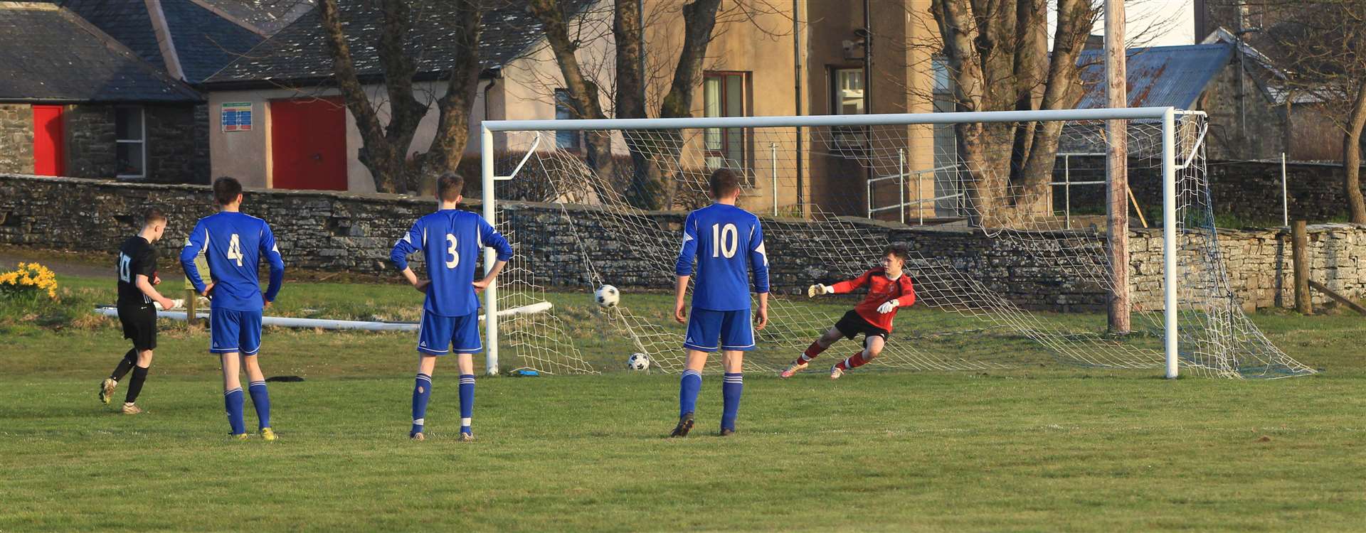 Lewis Mackillop puts Lybster ahead against Keiss from the penalty spot. Picture: Alan Hendry
