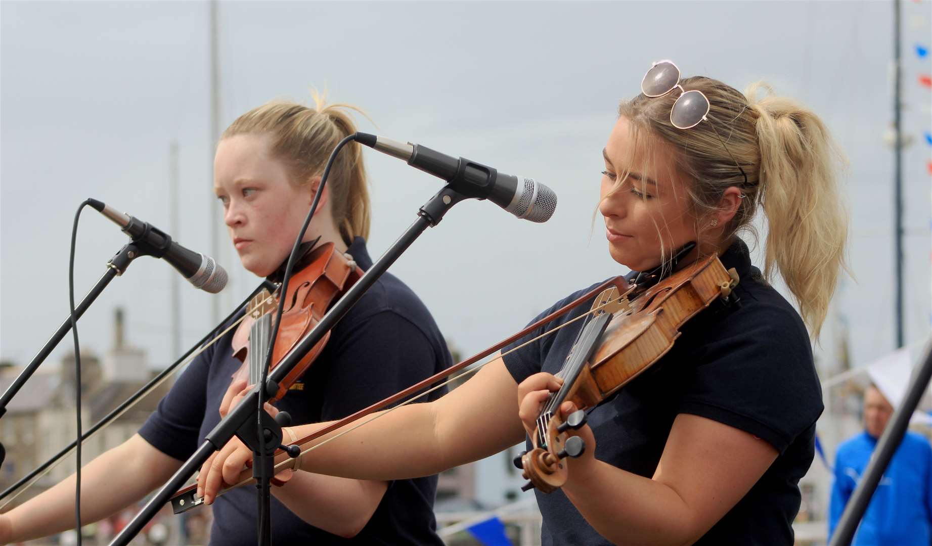 Fiddlers Camilla Elder (left) and Emily Morrison during one of the traditional music performances on the quayside. Picture: Alan Hendry