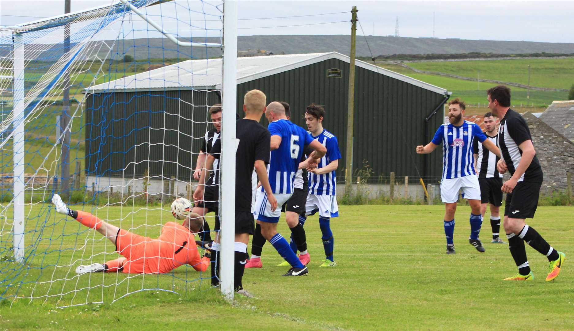 A scramble in Swifts' penalty box as Lybster try to find a way through during the first half of Tuesday's David Allan Shield match.