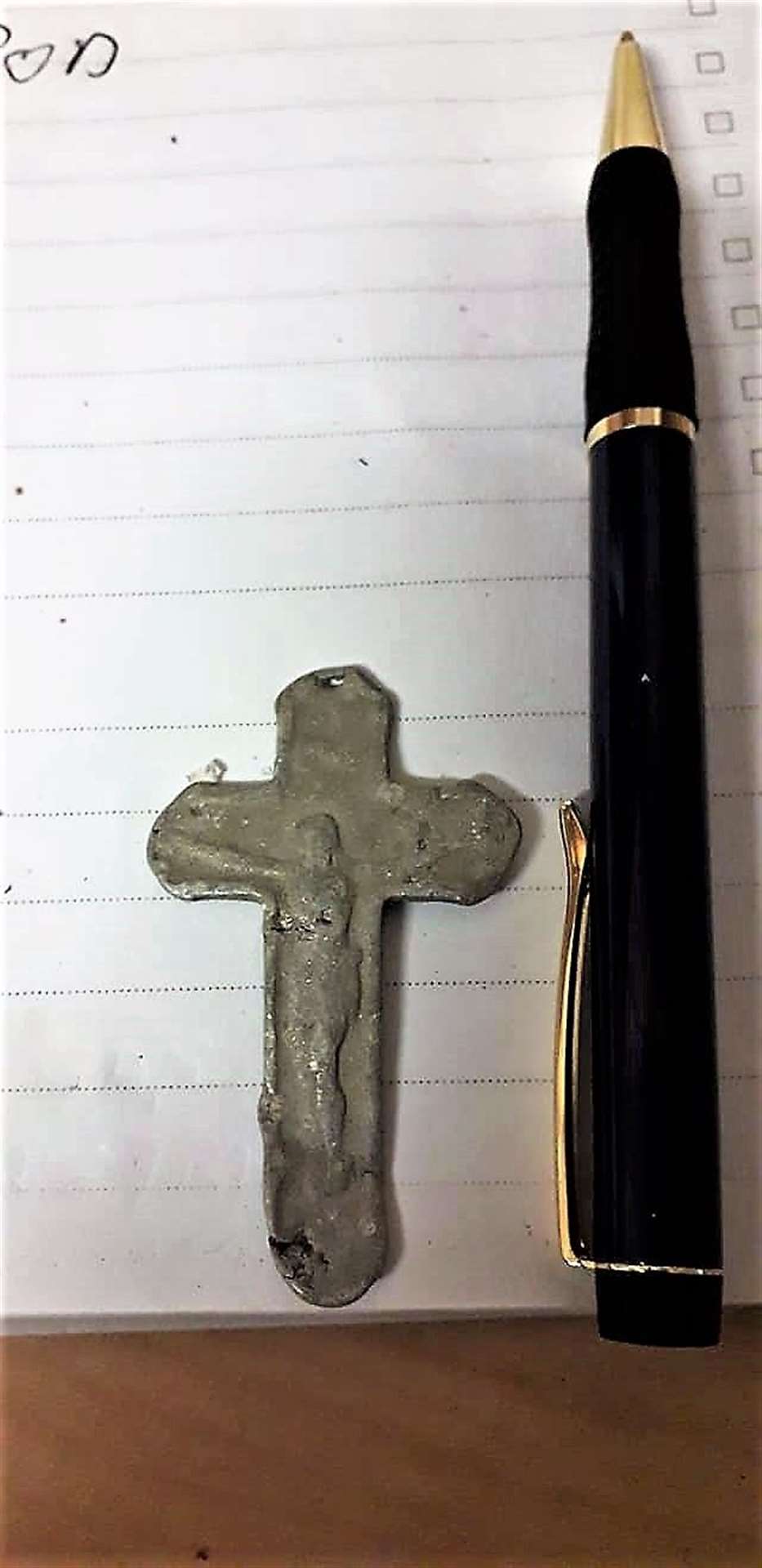 Mike set a pen beside the cross as a size comparison.