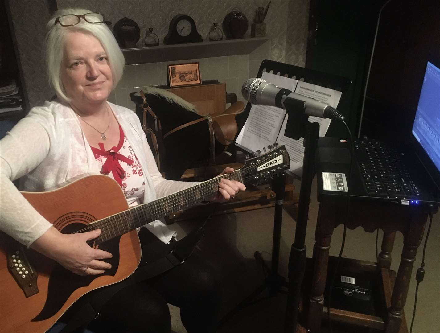 Christine Stone performing one of the songs for the weekly Peedie Café social media slot.