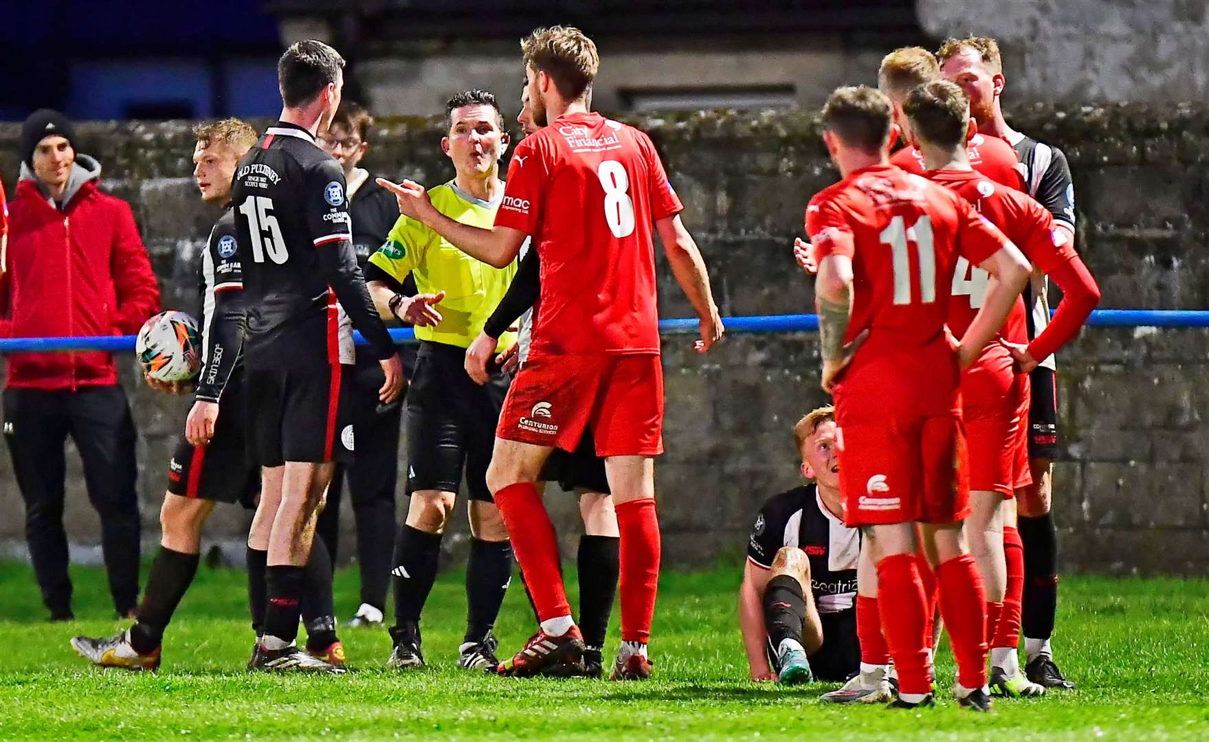 A flashpoint in the far north derby after Brora's Mark Nicolson appeared to stand on Wick Academy's Ross Gunn. Picture: Mel Roger