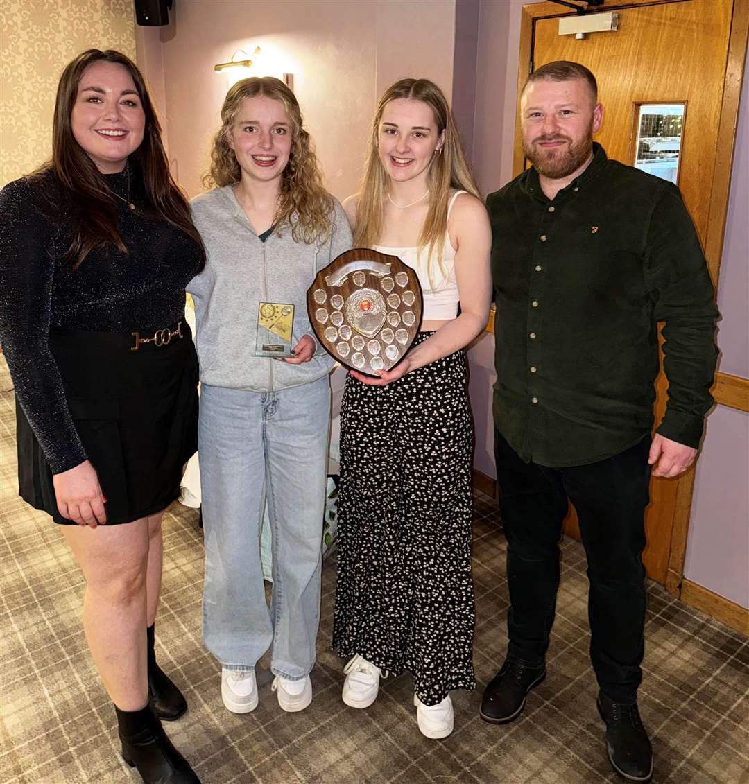 Women’s doubles winners Gemma Foulis and Shannon Leslie with Kate Mackay (Caithness Badminton Association) and Mark Mackay (Dounreay Communities Fund).