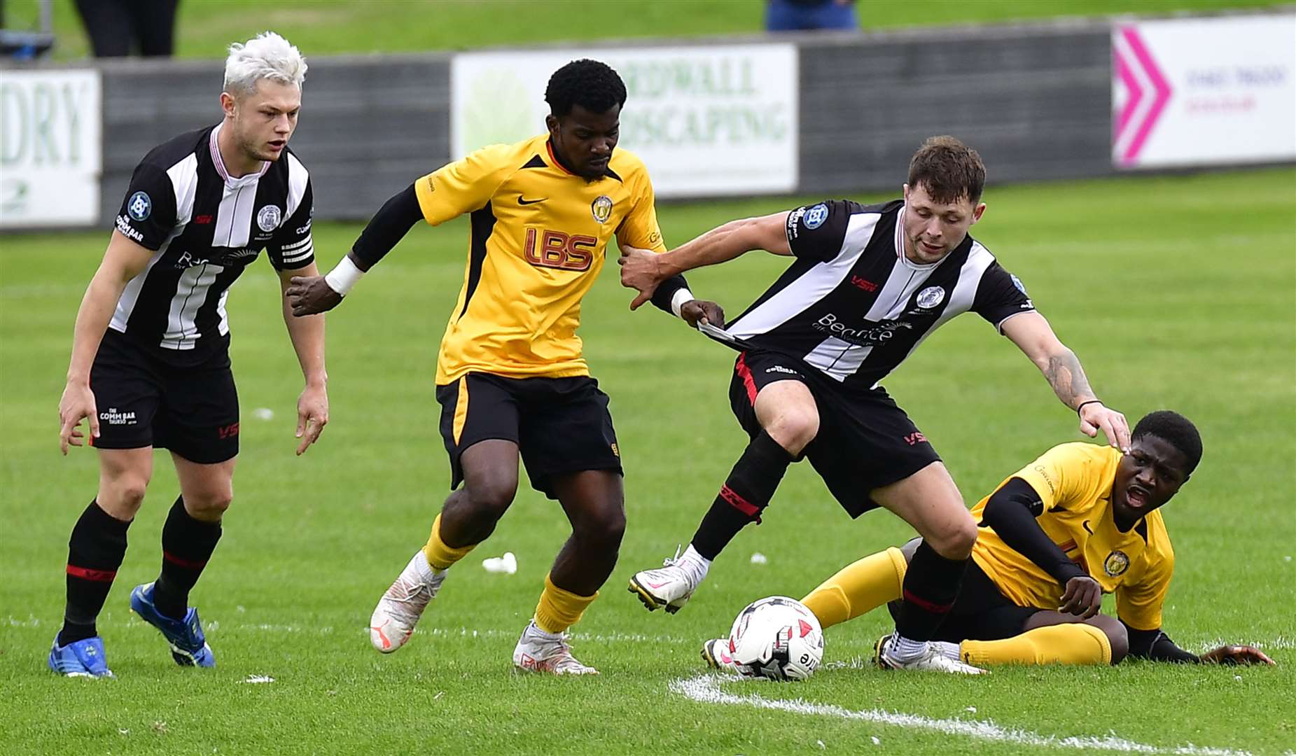 Jack Henry is pulled back by Joseph Kalbah in this season's first meeting between Wick Academy and Fort William, in October, when the Scorries won 3-1. Picture: Mel Roger