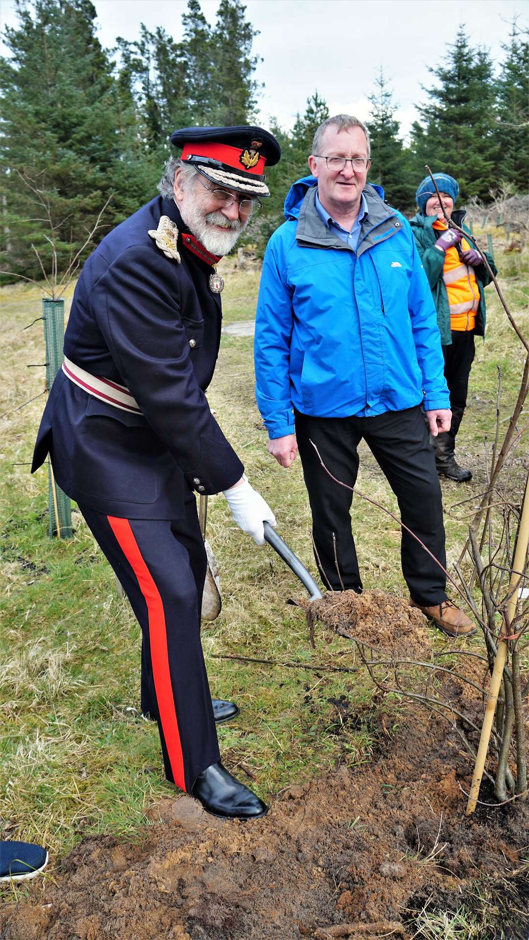 Lord Thurso puts in the final spade of earth as Allan Tait from Caithness Voluntary Group looks on. Picture: DGS