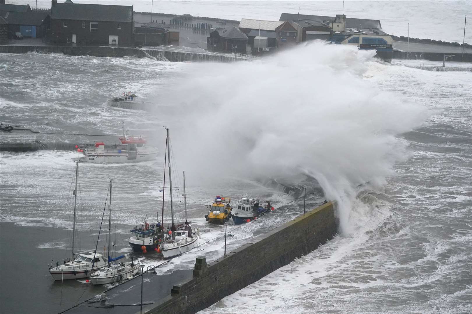Waves at Stonehaven Harbour (Credit: Andrew Milligan/ PA)