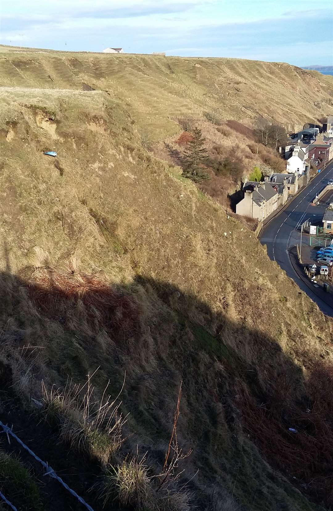 Scrabster: Landslips have been caused by 'unstable cliffs due partly to excessive drainage outflows'.