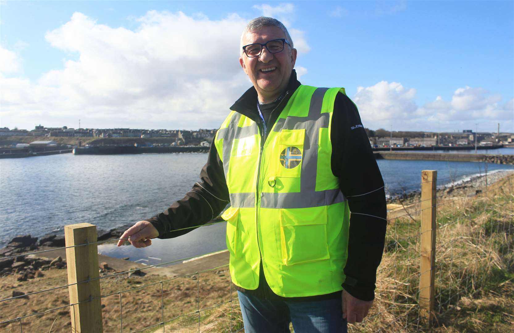 Willie Watt on the North Head footpath wearing one of Wick Paths Group's new hi-vis vests. Picture: Alan Hendry