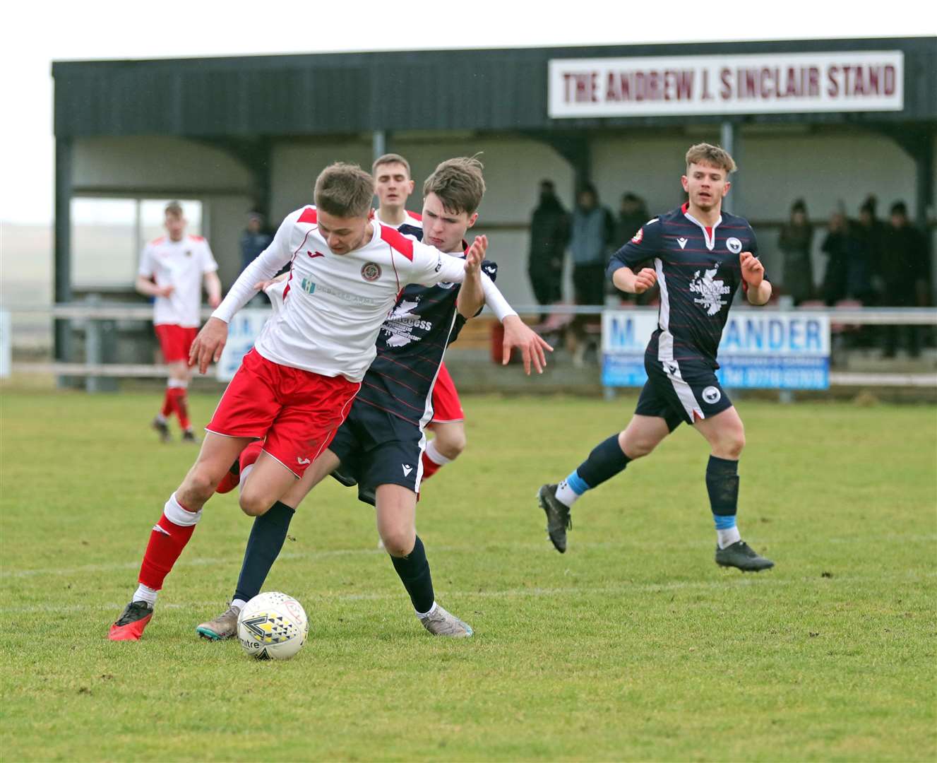 James Mackintosh tries to get past Brodie Watson during Halkirk United's recent 2-0 home victory over Inverness Athletic. Picture: James Gunn