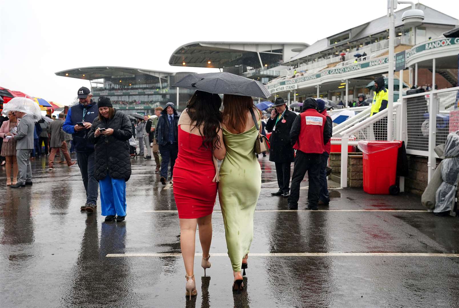 Umbrellas were a must-have addition to many outfits on the day (David Davies for The Jockey Club/PA)