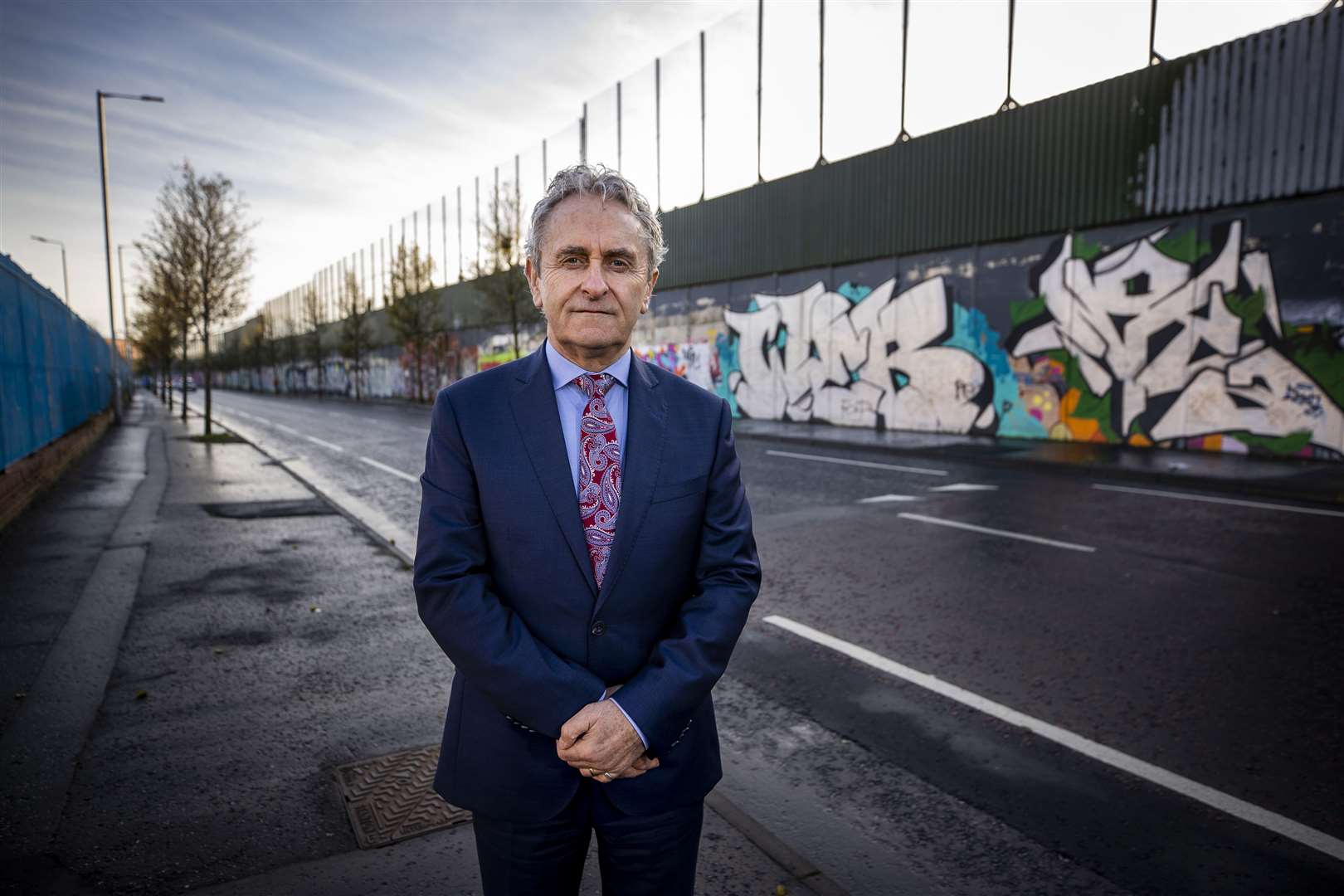 Paddy Harte, chairman of the International Fund for Ireland, at Belfast’s Peace Walls (Liam McBurney/PA)