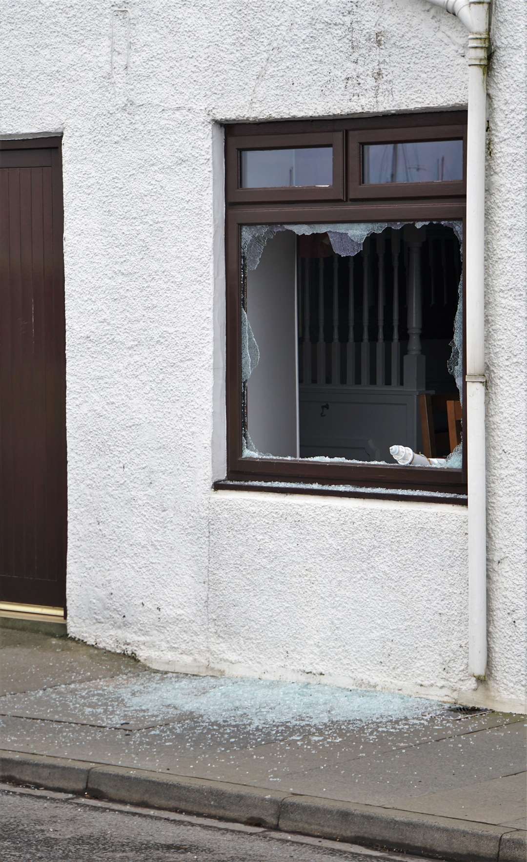Window smashed at the area where entry to the premises was presumably made. Pictures: DGS