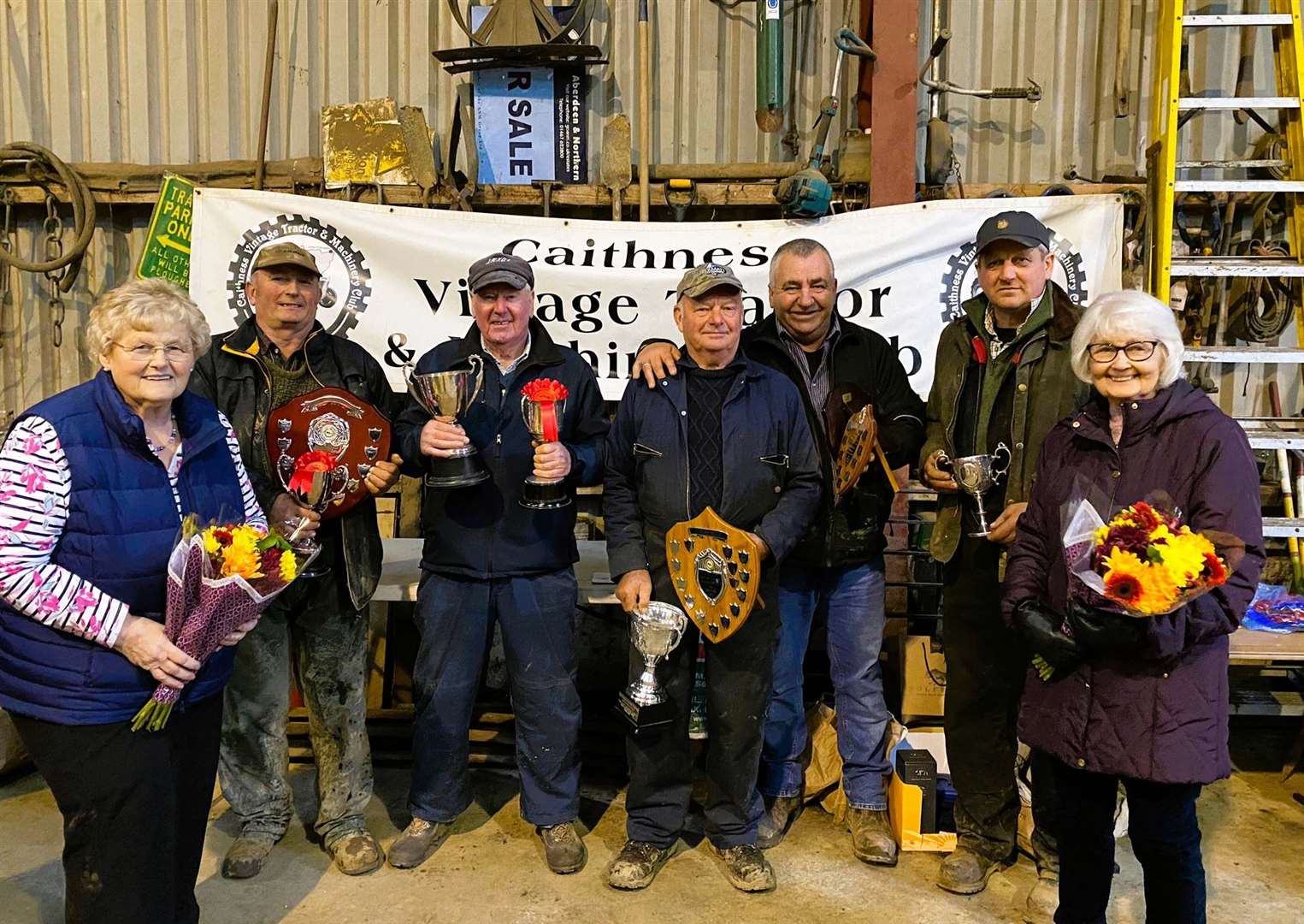 The winners with their trophies are flanked by the ladies who presented prizes. From left, Joanna Mackay, Andrew Sinclair, Gerald Macleod, Jonnie Mathieson, Martin Munro, Michael Mackay (overall winner) and Jane Fraser. Picture: Liz Hewitson