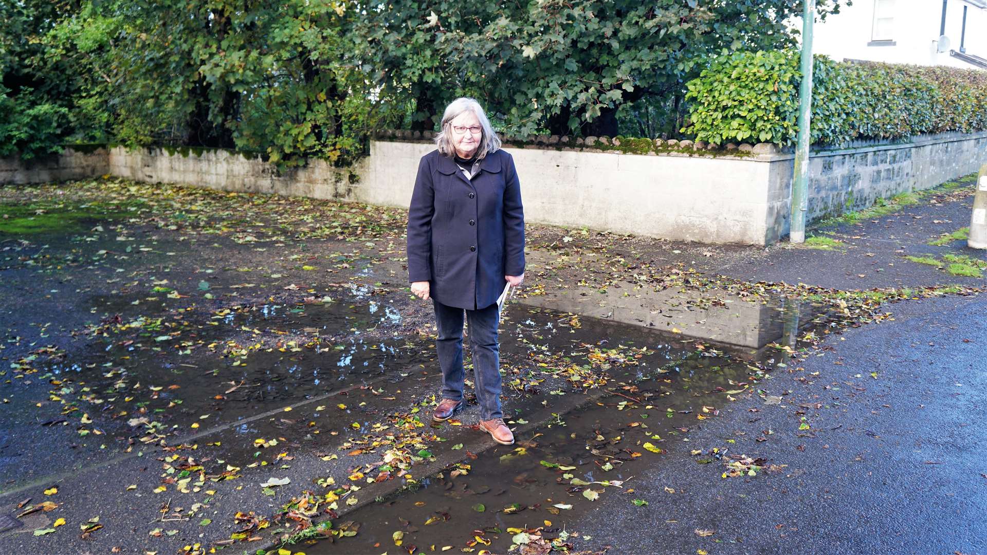 Cllr Jan McEwan at one of the blocked drains in Watten last month. Picture: DGS