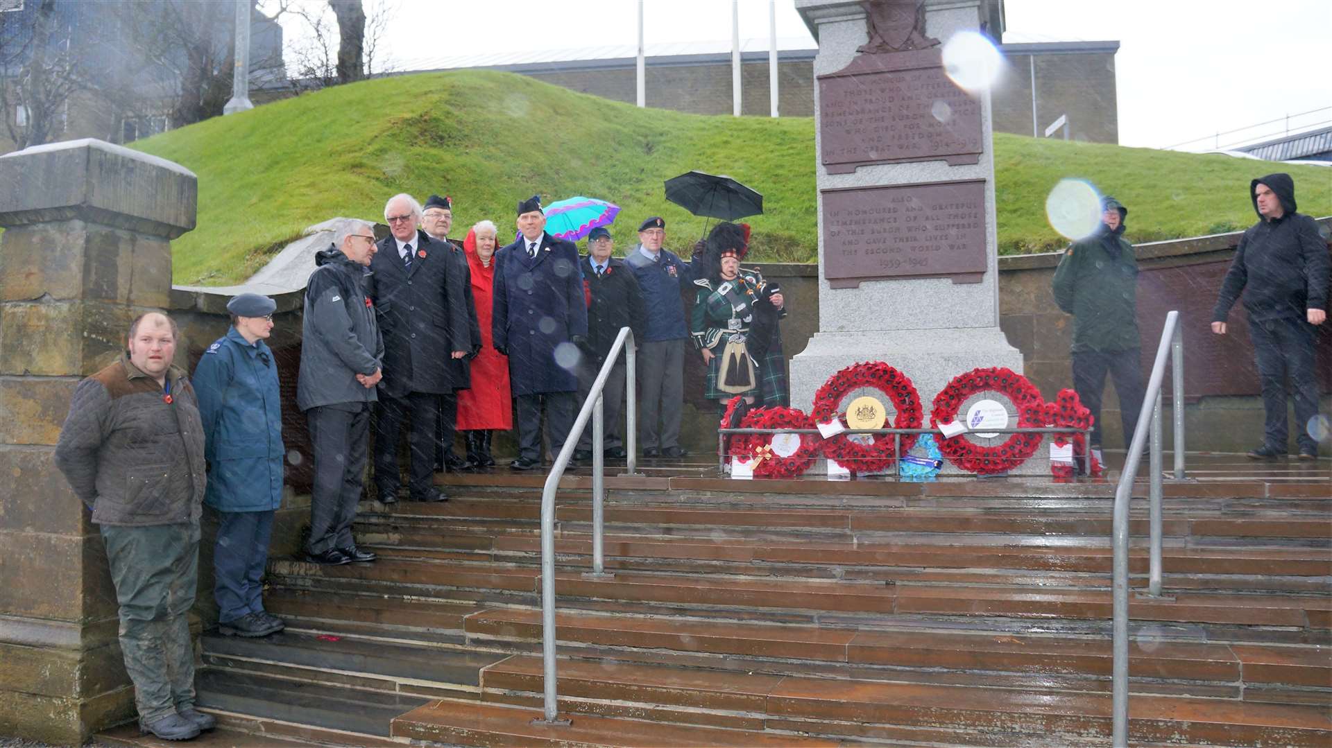 Murray Lamont, fourth from left, managed to rush down to Wick's war memorial from Pulteney House for the Armistice Day two-minute silence at 11am.