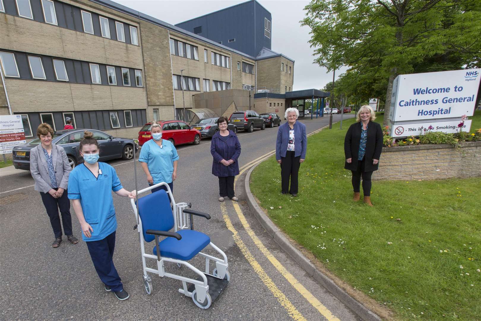 Radiographer Eilidh Sinclair (foreground) and assistant practitioner Kayleigh Brock with the specially adapted wheelchair, while looking on are some members of the League of Friends – (from left) committee member Barbara Nicol, treasurer Lorette Mackay, secretary Lottie Shearer and committee member Marjory Miller. Picture: Robert MacDonald / Northern Studios