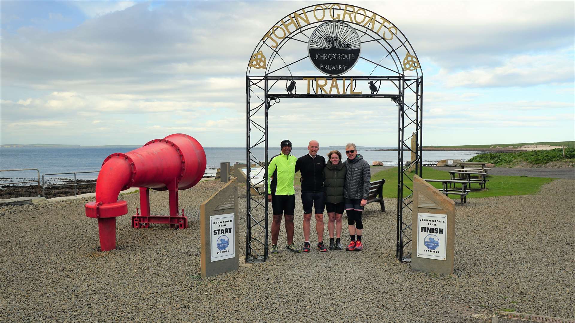 The Spectrum team at John O'Groats' official start and end point. Picture: DGS