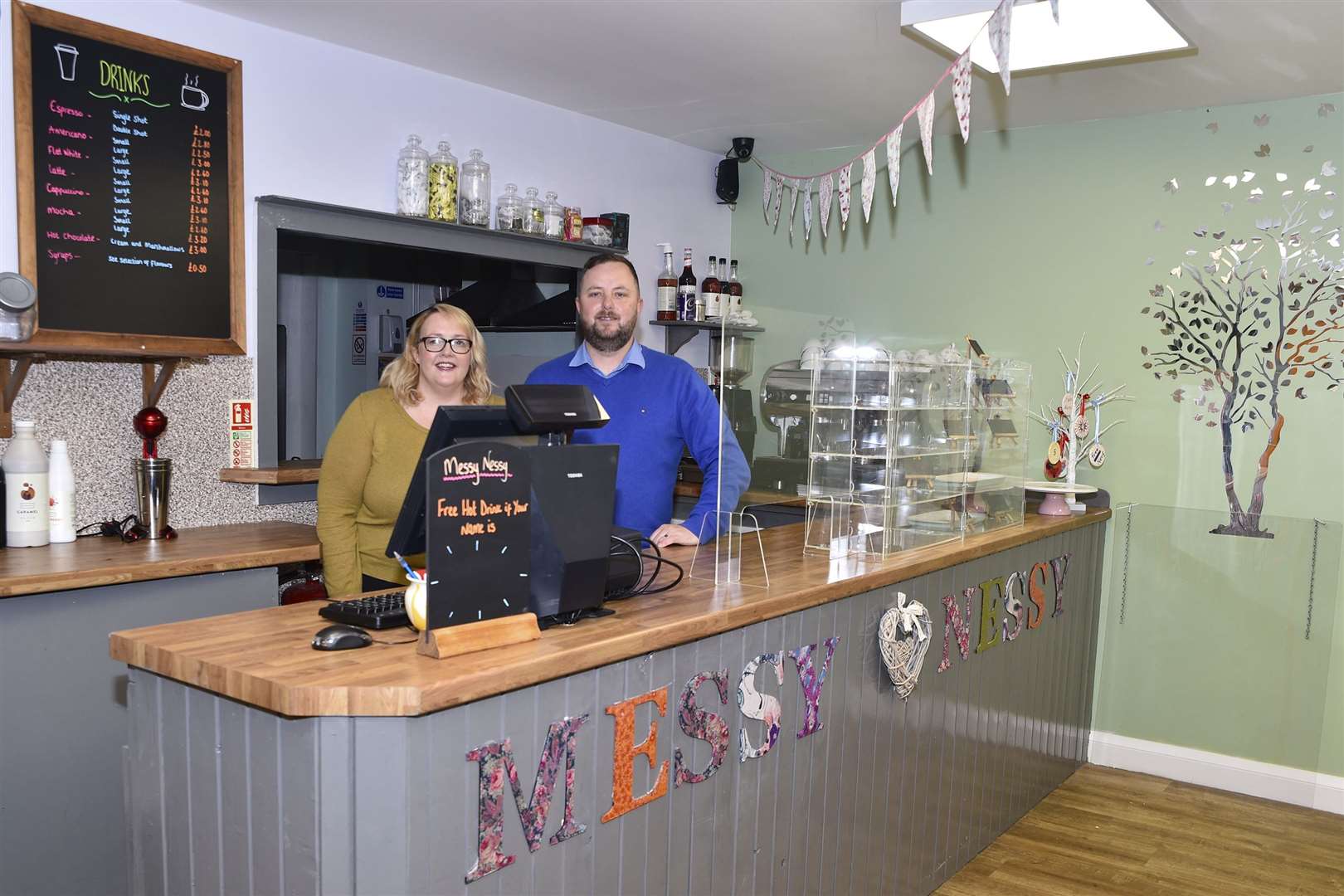 Fiona and Ian Carlisle behind the counter in the Messy Nessy coffee shop. They say they have been inundated with supportive messages. Picture: Mel Roger