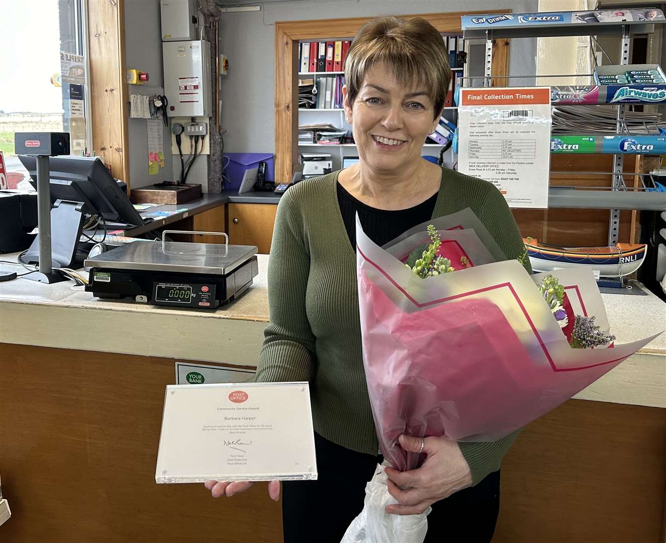 Fiona Harper received a 30-year long service award from the Post Office.