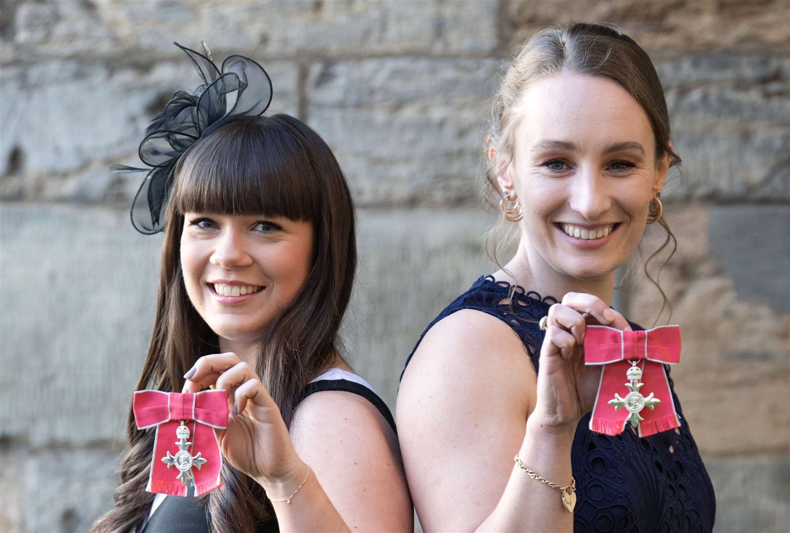 Jennifer Dodds (right) and Hailey Duff, members of the British Olympic Curling Team after being made MBEs during an investiture ceremony at the Palace Of Holyroodhouse, Edinburgh (Lesley Martin/PA)