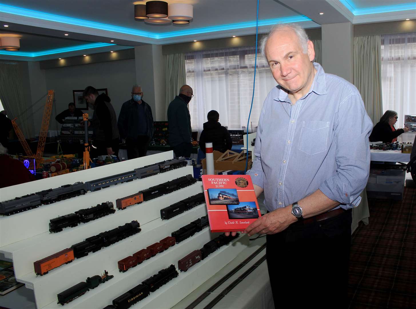 Model train enthusiast Bill Staley, from Ardrishaig, with some of his American steam locomotives. Picture: Alan Hendry