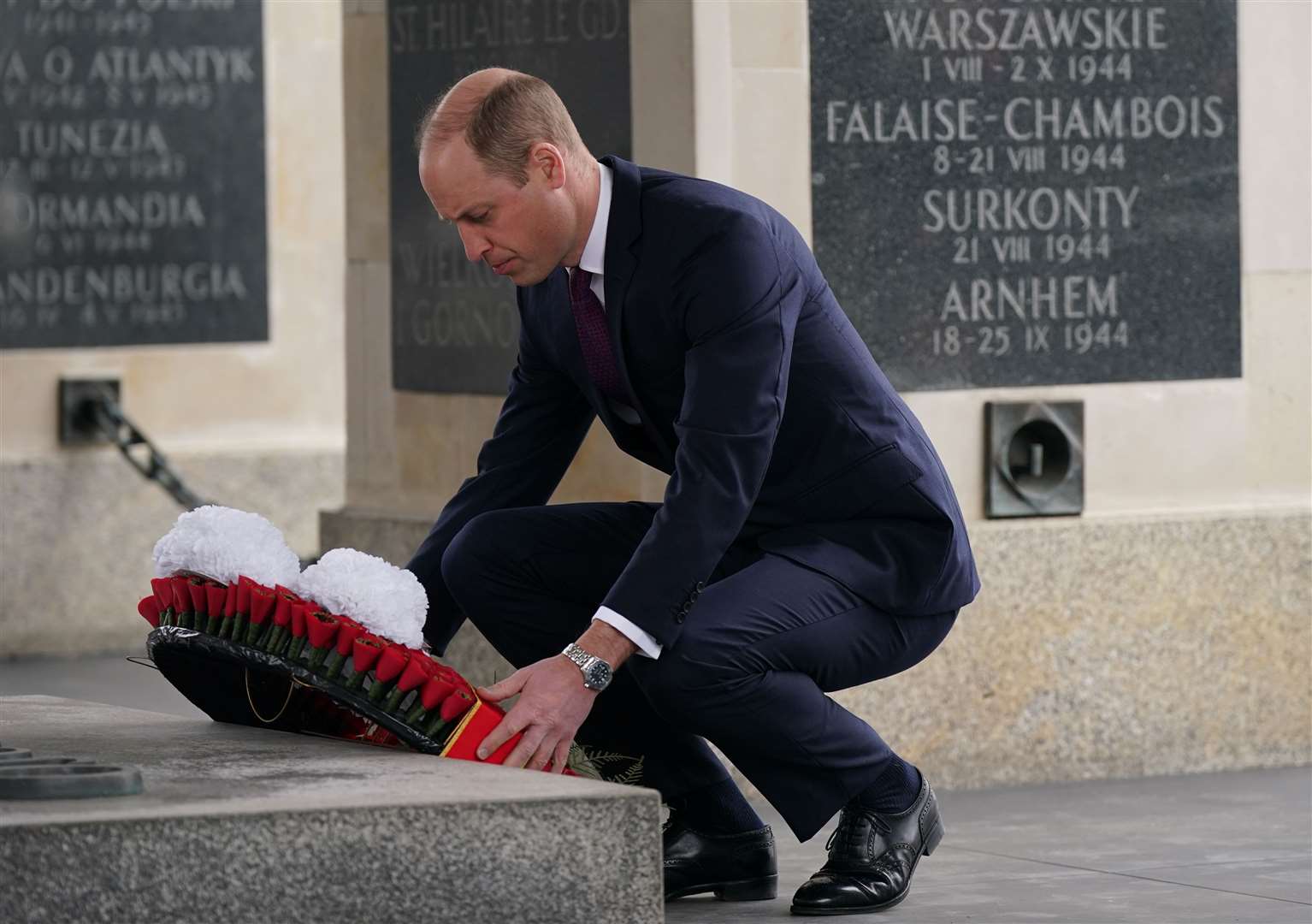 The Prince of Wales lays a wreath at the Tomb of the Unknown Soldier, a monument dedicated to Polish soldiers who lost their lives in conflict, during his visit to Warsaw (Yui Mok/PA)