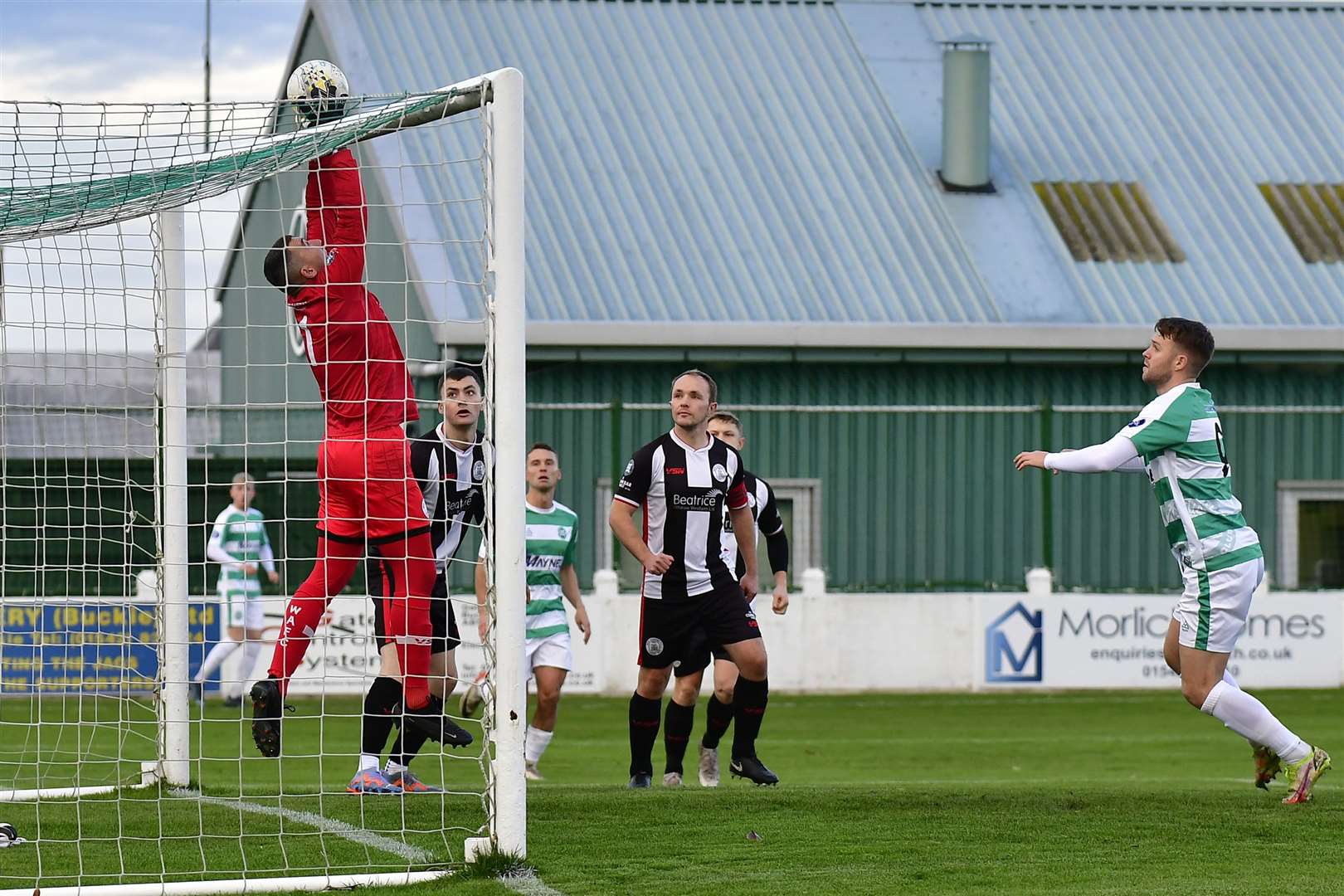 Wick Academy keeper Graeme Williamson stops a header from Buckie's Josh Peters during the match at Victoria Park in November in which the Jags ran out 5-2 winners. Picture: Mel Roger