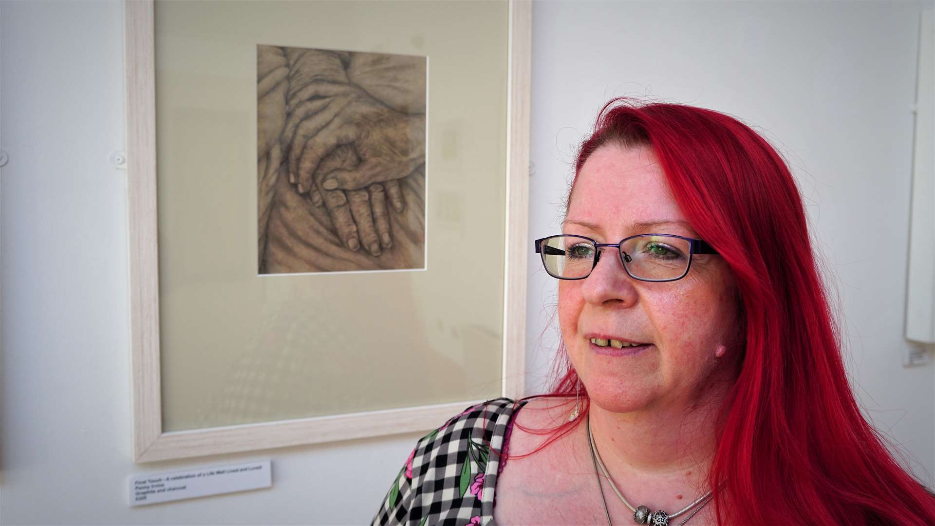 Penny Irvine with one of her graphite and charcoal artworks that can be seen in the show. Picture: DGS