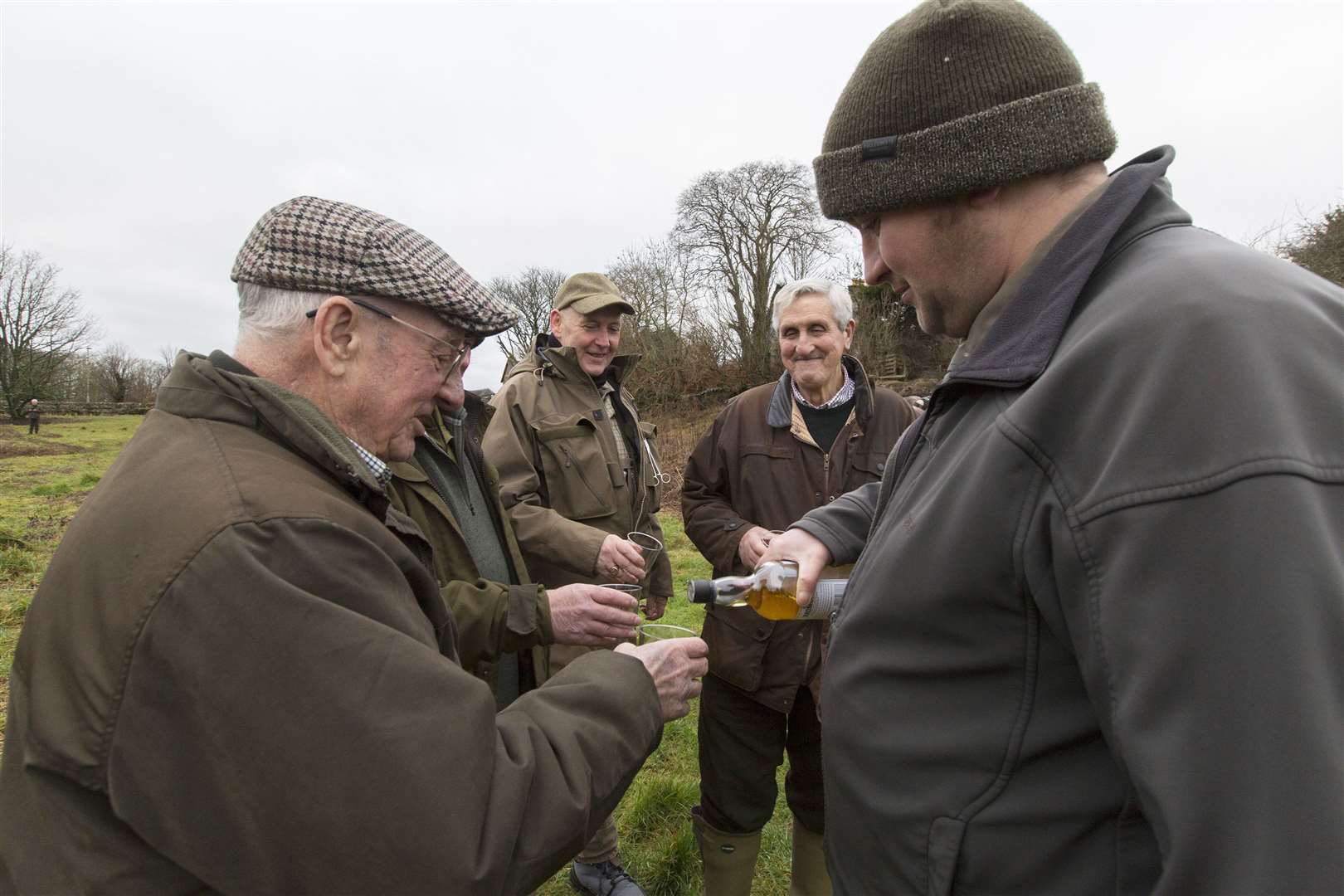 Preparing for the opening of the 2024 salmon season, senior ghillie Geordie Doull serves up the traditional dram. Picture: Robert MacDonald / Northern Studios