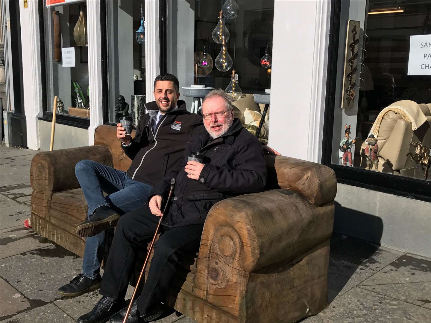 This new wooden sofa outside Sams Furniture in Wick is proving to be a popular addition to the town centre. Enjoying a coffee in the sunshine on Monday morning are store owner Sam Salim (left) and his friend Meinrad Waldkirch.