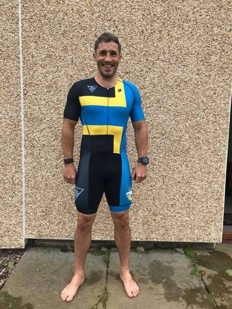 Wick Triathlon Club member David McCarthy kitted out in the new club tri suit.