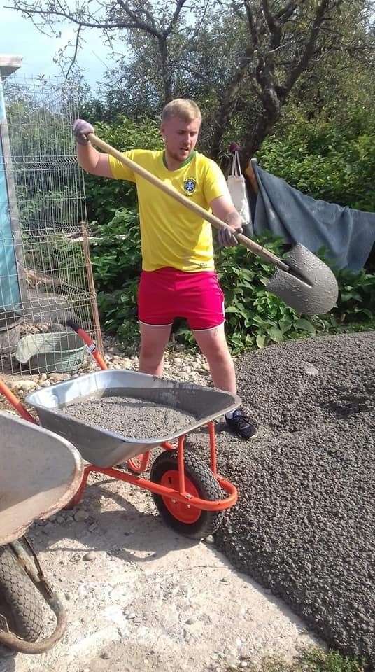 Logan Henderson is photographed here as he helps out with the concreting at the dog shelter in Baia Mare, Romania.
