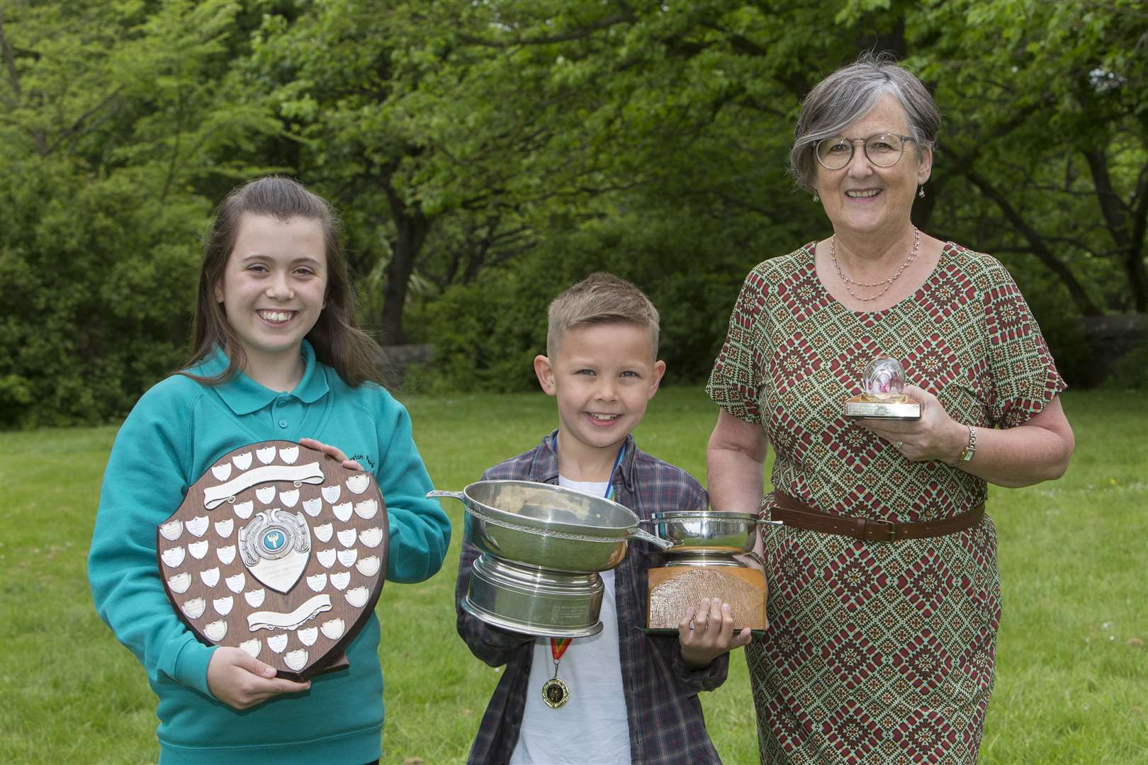 Alex Vines won the Field of Noss Quaich, the overall trophy for the children's Caithness dialect classes, and also received the James M Gunn Dialect Quaich for the P5 class. Lily Sutherland received the Omand Shield for P7 and Marney Bruce won the adult class, receiving the Caithness Glass Paperweight Trophy. Picture: Robert MacDonald / Northern Studios