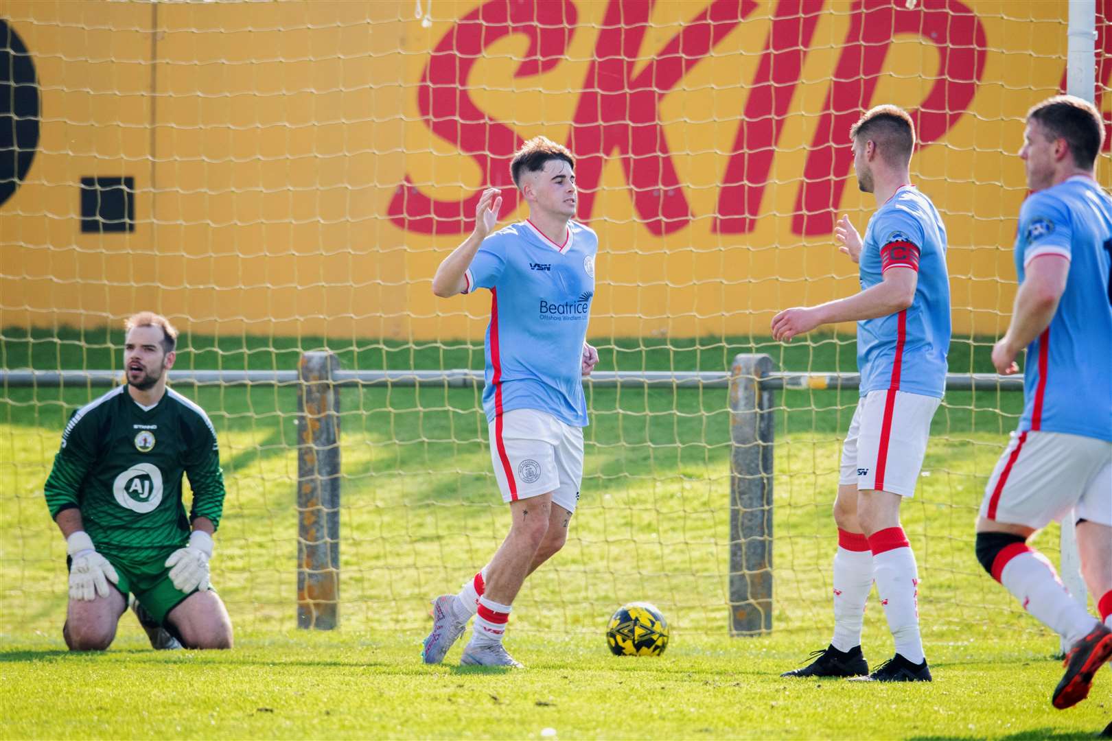 Gary Pullen celebrates with Marc Macgregor and Davie Allan after opening the scoring for Wick Academy. Picture: Daniel Forsyth
